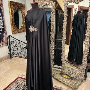 Pure silk kaftan dress embellished with pearls,beads.Beautifully embroided